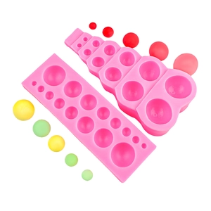 Pink silicone mold set for chocolate spheres and round cake decorations in various sizes