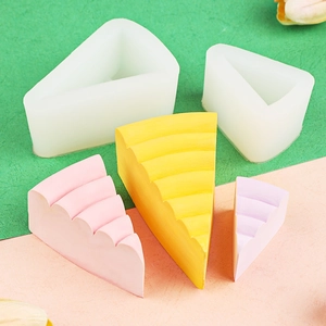 Triangle cheesecake silicone molds with layered rainbow cake slices for baking and crafts