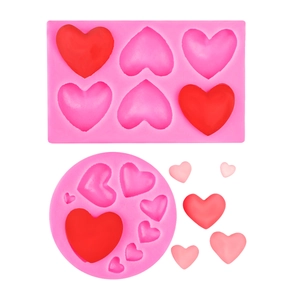 Pink heart-shaped silicone mold set for Valentine cakes, chocolate and scented candles