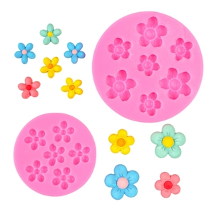 Pink silicone flower mold for cherry blossoms and sunflowers with various clay samples