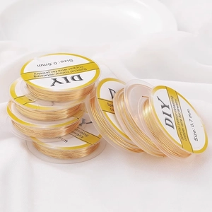 Detailopname van 14K goudgevulde koperdraadspoelen voor DIY sieraden in 0,6mm en 0,7mm