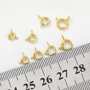 Detailed close-up of 6mm 14K gold filled spring ring clasps for jewelry making