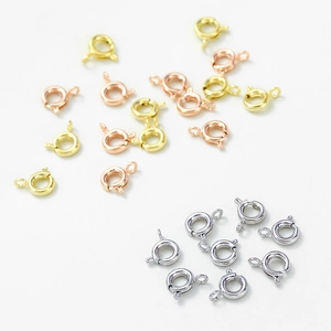 Detail showing assorted 14K gold-plated spring ring clasps in gold silver and rose gold