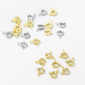 Macro detail of 14K gold plated and silver spring ring clasps for jewelry making