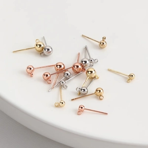 Macro detail of S925 sterling silver earring studs with ball head and loop connectors