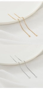 Detailed view of 18K gold and silver plated box chain ear threads with jump ring loop