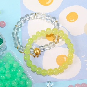 8mm jade-like glass bead bracelets in lime green and clear crystal with sun charm