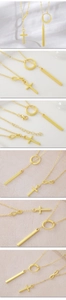 Detail of gold plated necklaces with infinity, cross and bar geometric pendants