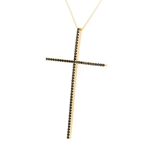 Detail of a thin gold cross pendant featuring micro-paved black zircon stones on a fine chain