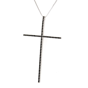 Detail shot of cross pendant featuring micro-pave black cubic zirconia in silver base