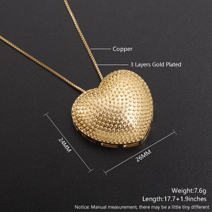 Detailed view of 18k gold plated heart pendant with textured finish and measurements