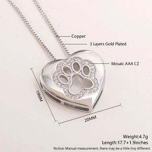 Detailed view of copper heart pendant with gold plating and AAA cubic zirconia paw print