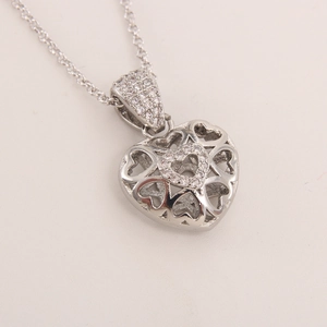 Silver hollow heart pendant necklace with 18k gold plating and sparkling zircon stones