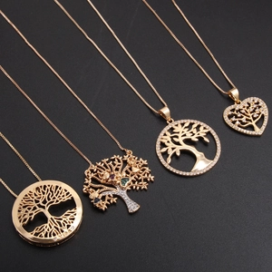 18k gold plated Tree of Life necklaces with colorful zircon stones on black background