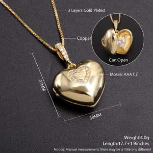 Detail of 18k gold plated hollow heart locket necklace with sparkling zircon inlay