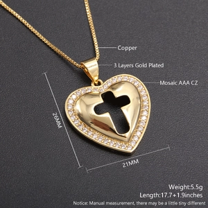 Macro detail of 18k gold plated heart cross pendant with AAA cubic zirconia stones