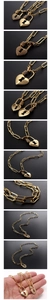 Macro shot of 18K gold heart lock pendant and paperclip chain necklace with zircons