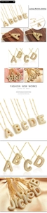 Detailed macro view of gold-plated balloon letter pendant with sparkling zircon inlays