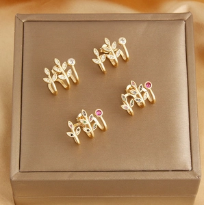 Leaf shaped 18k gold plated ear cuffs featuring colorful sparkling cubic zirconia stones