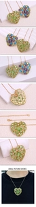 Macro detail of heart-shaped pendant necklace featuring colorful gemstones and 18k gold plating