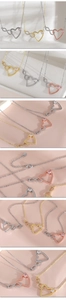 Detail view of 18k gold plated Mobius heart necklace with cubic zirconia in three finishes