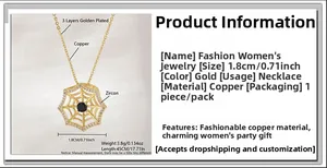 Close-up of gold-plated spider web pendant with a black stone and white cubic zirconia
