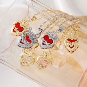 Sacred Heart and thorn rose pendant necklaces in gold and silver with zircon gemstones