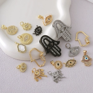 Micro-paved Hamsa Hand and Evil Eye charms in gold and silver plating for DIY jewelry