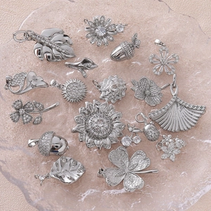 Silver flower pendant collection with sunflower clover and cherry blossom charms