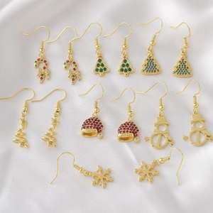Christmas earrings set featuring gold plated snowman candy cane and snowflake designs
