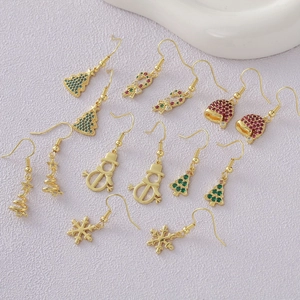 Detail of 18k gold plated Christmas earrings featuring festive trees and canes