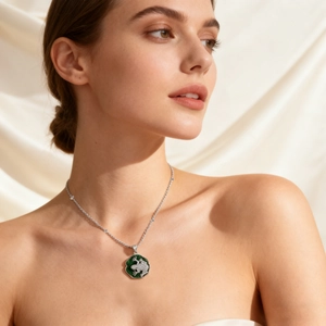 Green frog necklace with zircon stones on a silver chain worn by a female model