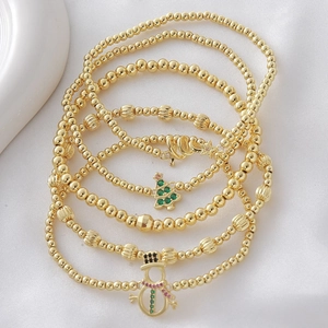 Set di 5 bracciali elastici dorati con ciondoli a forma di albero di Natale e pupazzo di neve