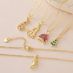 18k gold plated Christmas necklace set with festive charms like tree snowman and sock