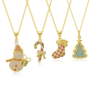 Detail of Christmas themed pendants with colorful cubic zirconia and gold plating