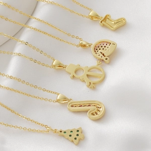 18k gold plated Christmas necklace set featuring snowman, tree, and sock charms on satin