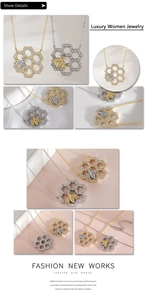Detail showing honey bee honeycomb necklace with sparkling zircons in gold and silver finish