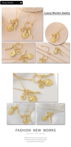 Detail of 18k gold plated necklace set with FÉ medal and heart sunburst pendant charms