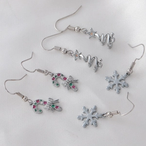 Christmas earrings set with silver snowman candy cane and snowflake festive designs