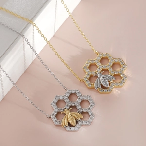 Elegant gold and silver honeycomb bee pendant necklaces with sparkling crystal pavé