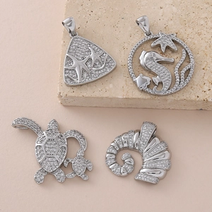 Micro-pave ocean pendant set featuring seahorse, turtle, and starfish in silver finish