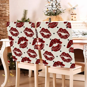 Detail of canvas chair covers featuring red leopard lips and black heart patterns