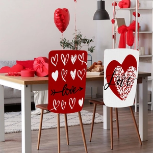 Close-up of Valentine heart chair covers with Love script and decorative balloons