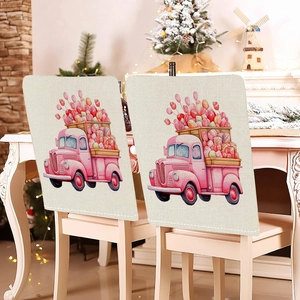 Dettaglio del coprisedia in lino beige con stampa di camion e palloncini a cuore
