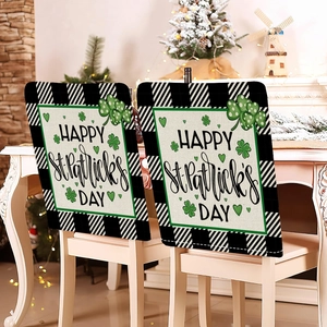 Pair of St. Patrick's Day chair covers with green shamrocks on black and white plaid