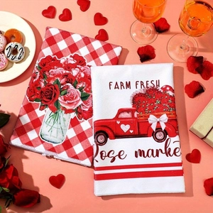 Valentine microfiber kitchen towels with red truck and floral patterns on table