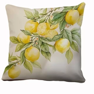 Square pillow cover with minimalist lemon print and green leaves on white background