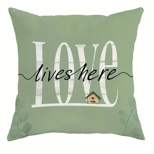 Green throw pillow cover with LOVE lives here print and delicate floral leaf patterns