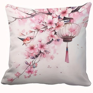 Pink floral pillow cover with cherry blossom, bird, and lantern art on a white background