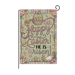 Close-up of Easter garden flag with bunny, eggs and He is Risen text on a black stand